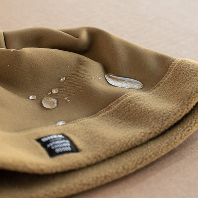 snek cycling hardface fleece beanie DWR water repellant finish detail photo with water beads
