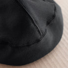 snek cycling hardface winter cap photo detail of cap back and flatlock construction