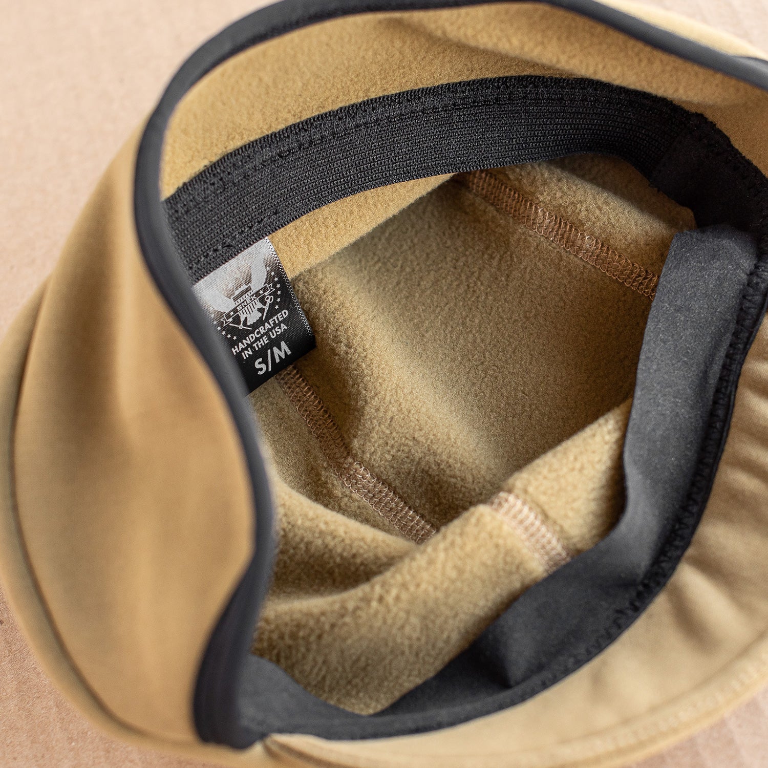 snek cycling polartec hardface winter cap detail of internal soft fleece lining in coyote brown