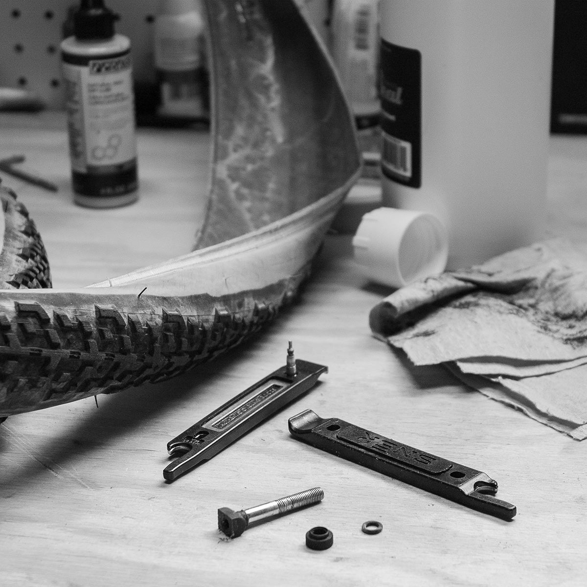 snek cycling lifeboat tire lever and valve core remover in shop workbench changing a flat tubeless tire