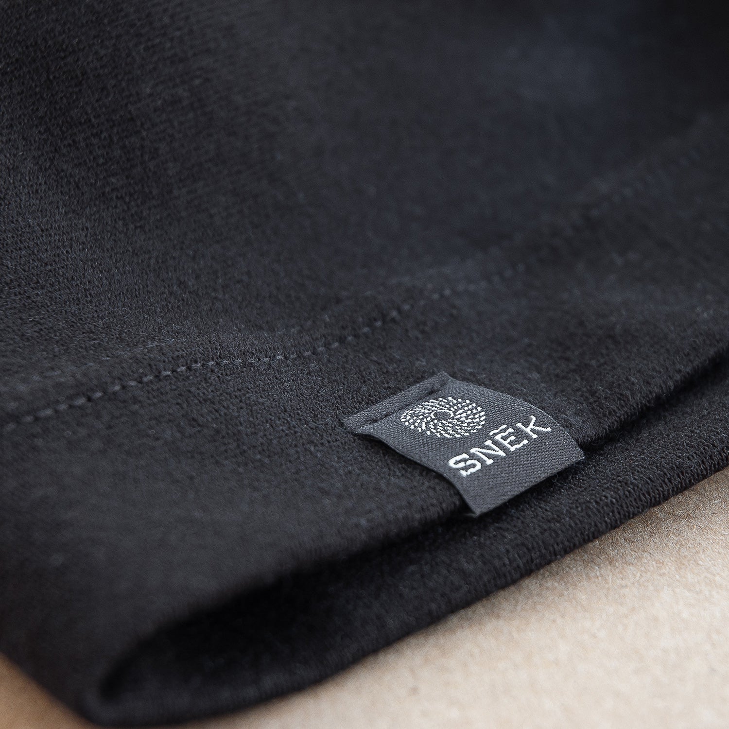 snek cycling merino beanie label