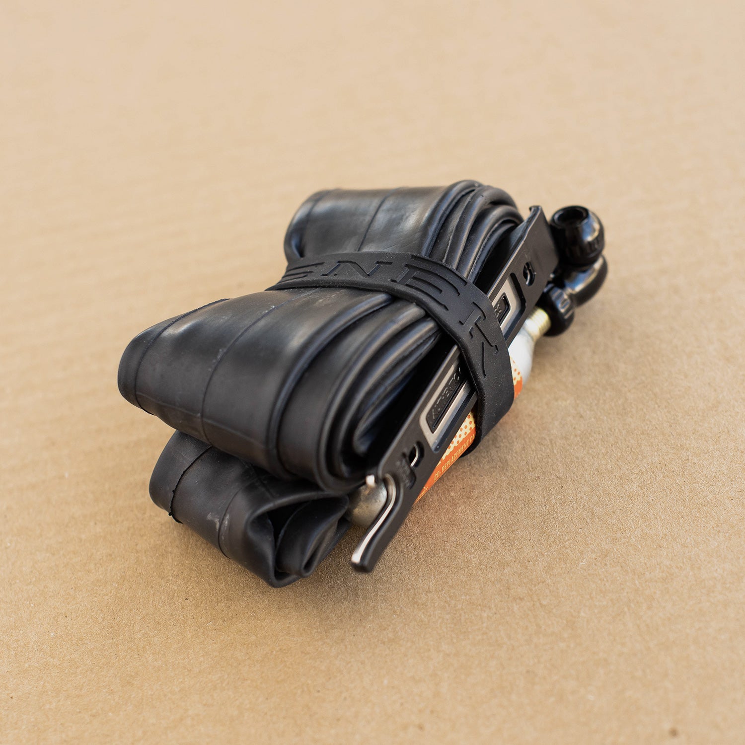 silicone band holding cycling tube, co2 catridge and tire lever together