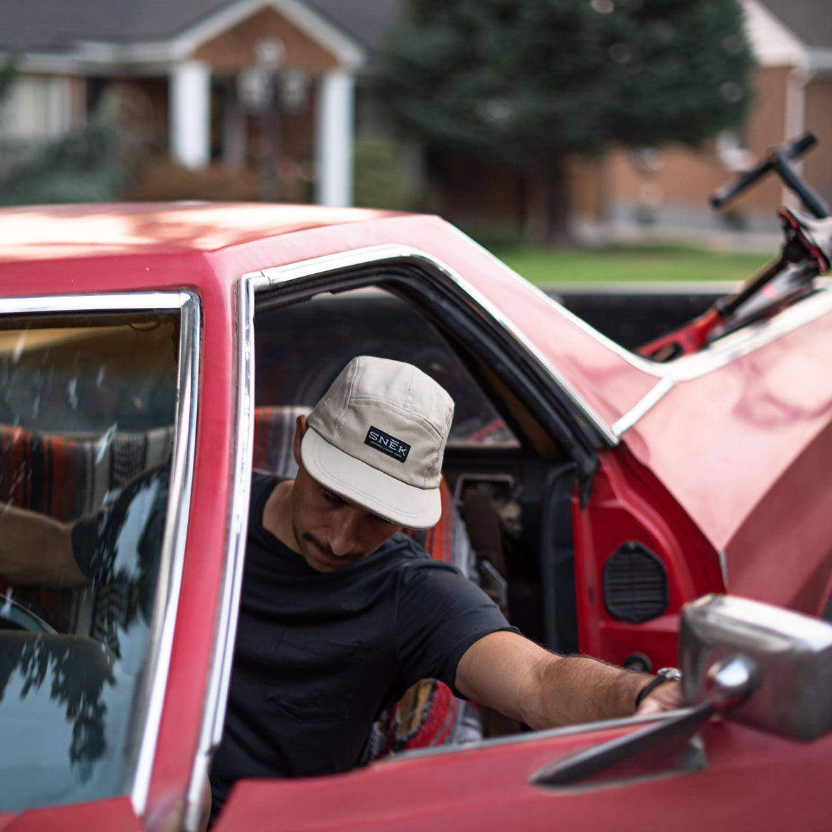 camper hat in ford ranchero with gravel bike in the bed