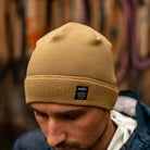 Model wearing the hardface polartec beanie with water repellant finish and water drop beads