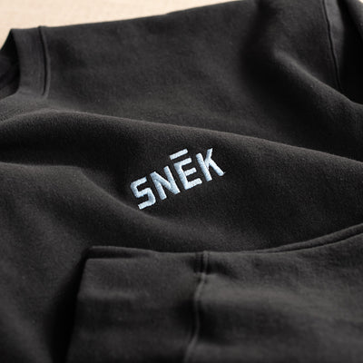 snek cycling logo crewneck sweatshirt embroidery detail