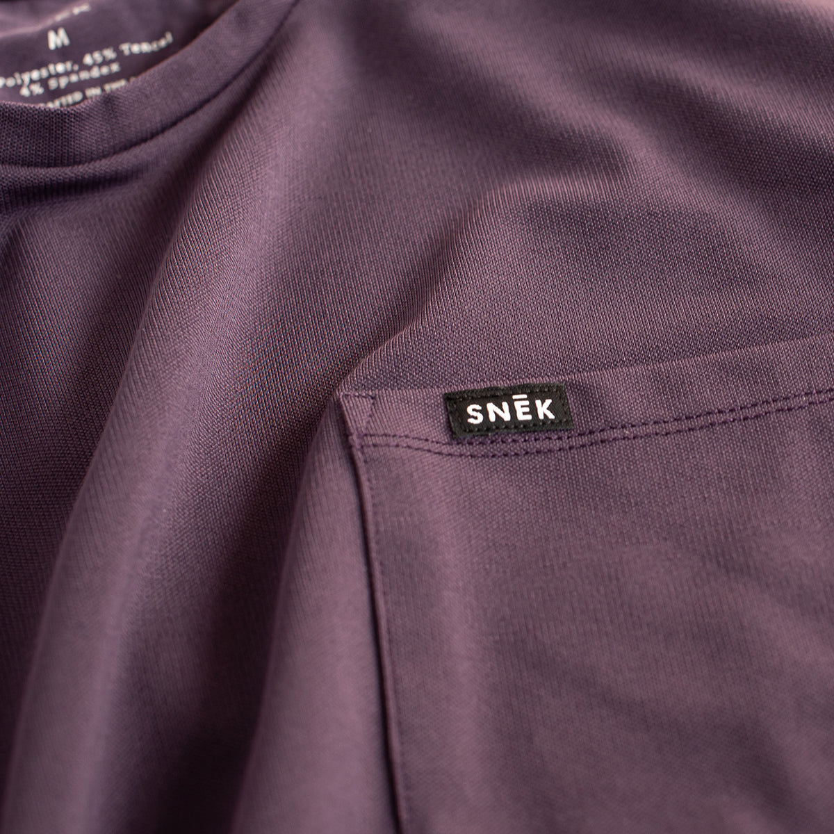snek cycling tee and jersey pocket and snek labe detail shot