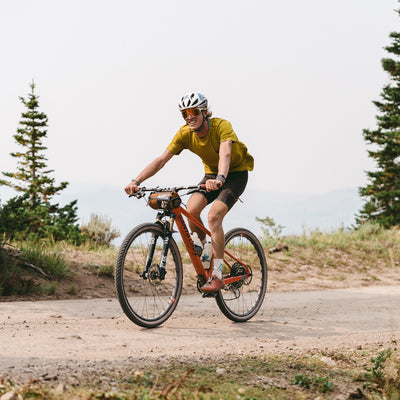 snek cycling flyweight lightweight pocket tee and jersey on TJ Eisenhart at the wasatch all-road gravel race in utah wit Santa Cruz bike