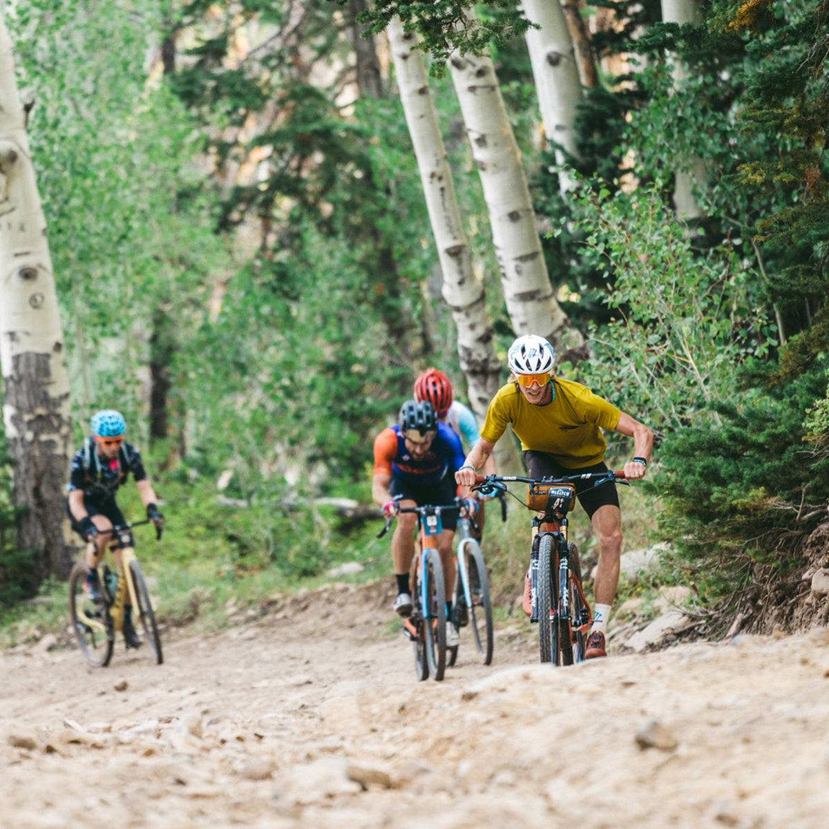 tj eisenhart climbing in the dry creek flyweight pocket tee at the Wasatch all-road race in utah