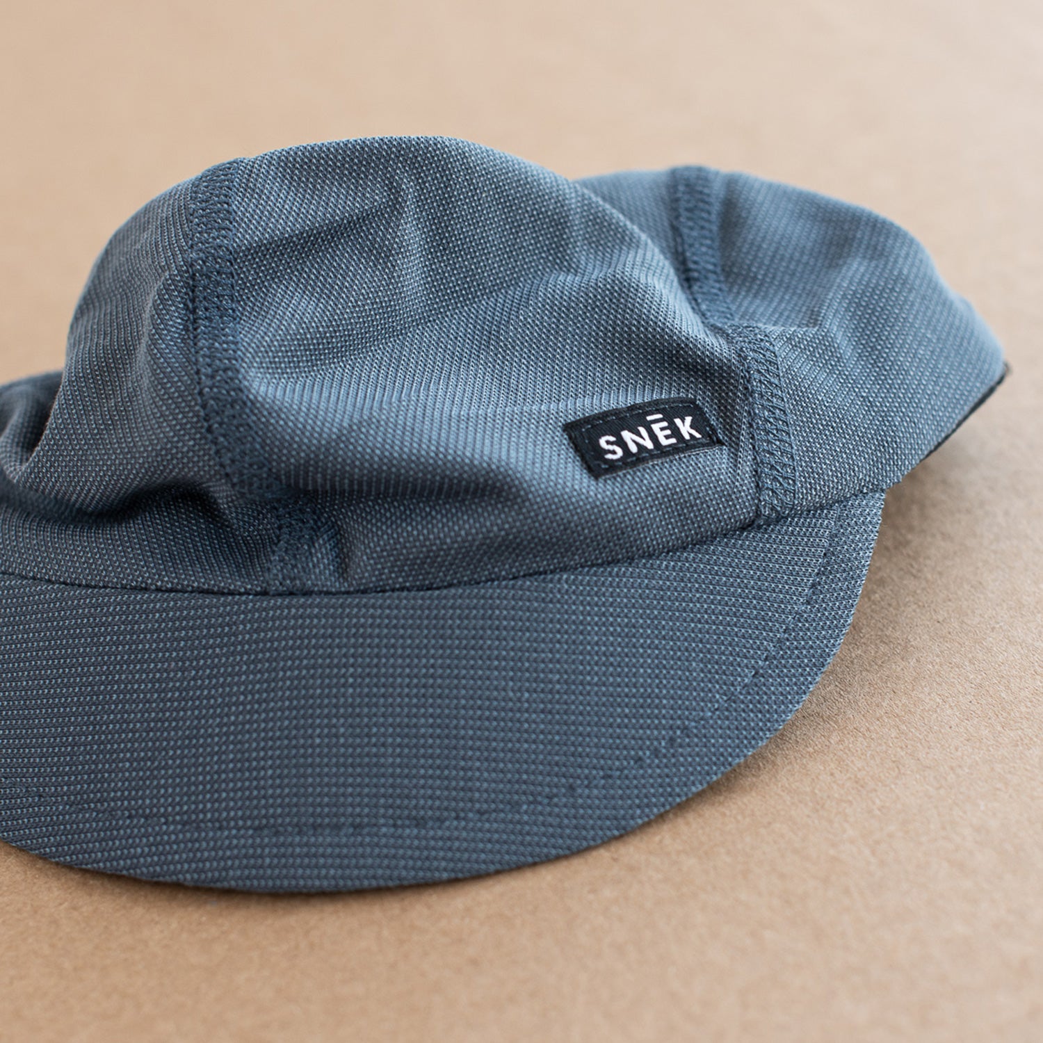 snek cycling blue summer cap brim and breathable fabric detail