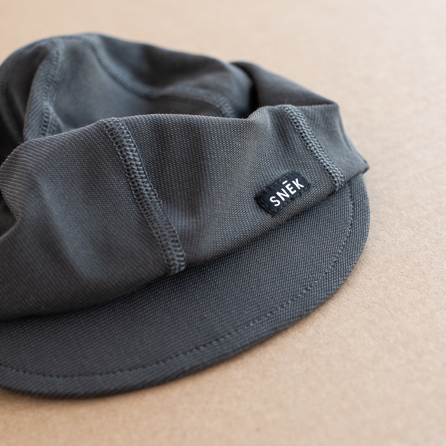 snek cycling lighweight breathable summer cap in charcoal
