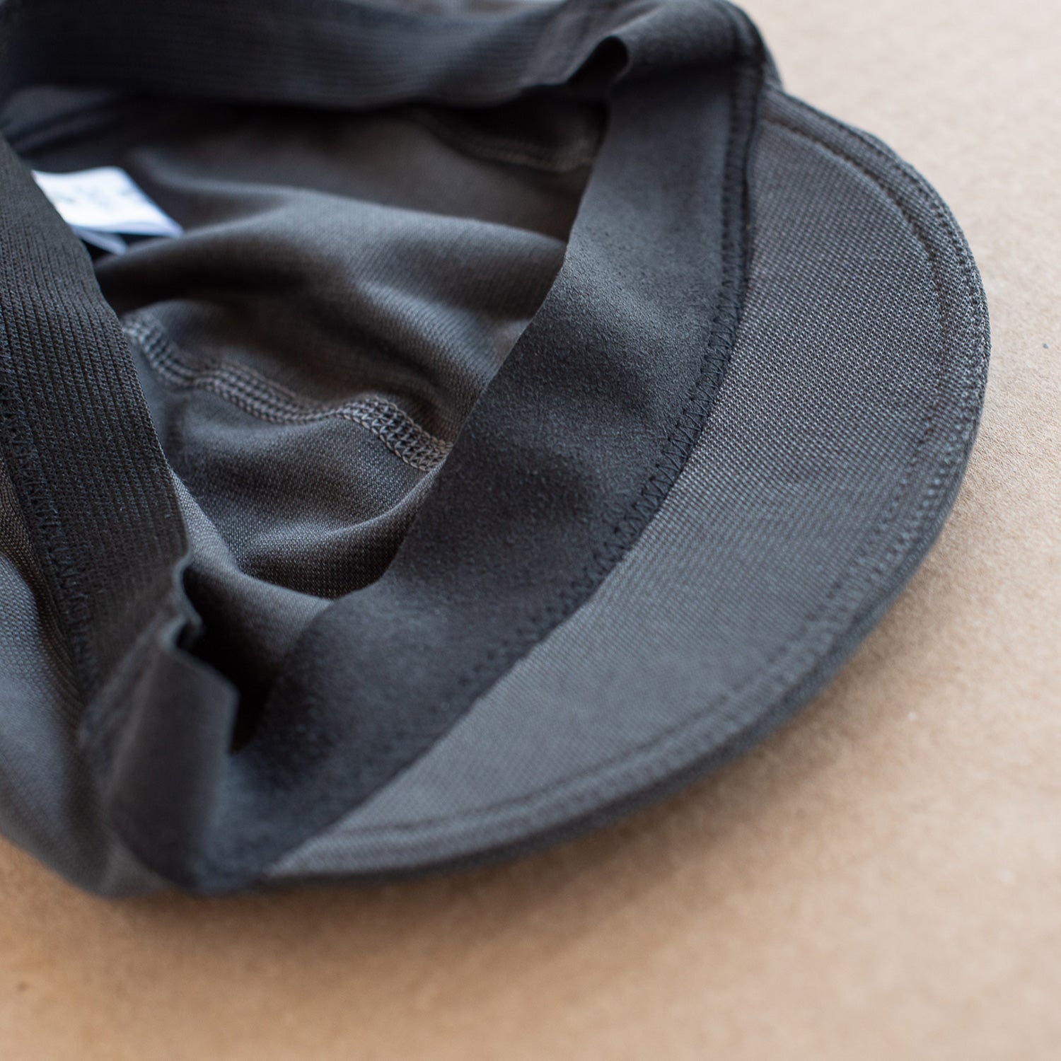 snek cycling dry creek summer cap charcoal suede brim and fabric 