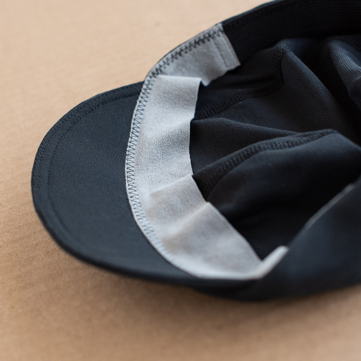 snek cycling cap sweat suede headband on black cap
