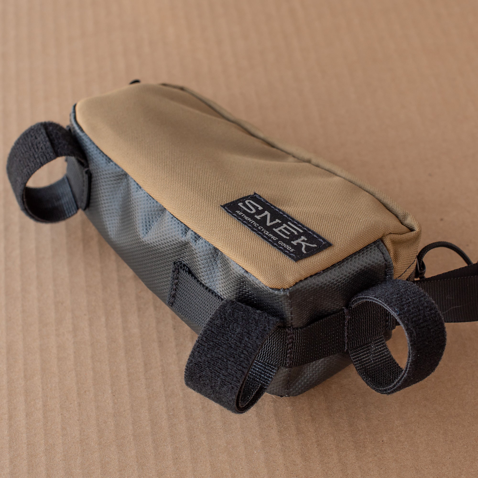 snek cycling top tube bottom PVC material with velcro webbing slots